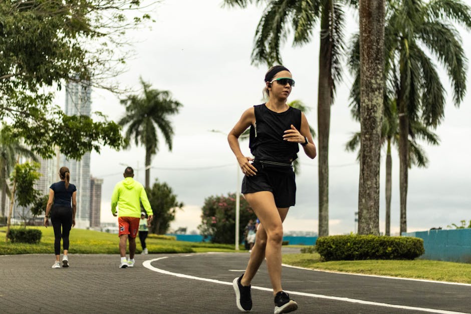 Woman jogging in a tropical park in Panama City on an overcast day.