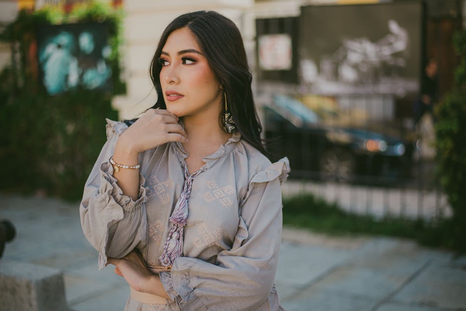 Stylish woman in urban setting exuding elegance and fashion-forward style.